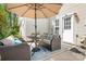An inviting outdoor patio with comfortable seating under a sunshade, perfect for relaxation at 7910 Camden Hollow Rd, Huntersville, NC 28078