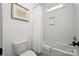 Bathroom with white subway tile, toilet and bath with shower at 7982 Buena Vista Dr, Denver, NC 28037