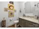 Bathroom features a granite-topped vanity and artistic wall decor at 7982 Buena Vista Dr, Denver, NC 28037