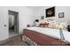 Bedroom with large bed and bedside tables; door to ensuite bathroom at 7982 Buena Vista Dr, Denver, NC 28037