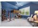 Stylish bedroom featuring a loft bed, large window, and comfortable seating area at 7982 Buena Vista Dr, Denver, NC 28037