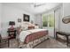 Bedroom with large bed and bedside tables in front of bright window at 7982 Buena Vista Dr, Denver, NC 28037