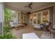 Comfortable covered patio with wicker furniture, a ceiling fan, and access to the interior at 7982 Buena Vista Dr, Denver, NC 28037