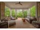 Inviting covered patio with wicker furniture, a ceiling fan, and a view of the backyard at 7982 Buena Vista Dr, Denver, NC 28037
