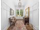 Elegant foyer with wood floors, board and batten walls, stylish decor, and ample natural light at 7982 Buena Vista Dr, Denver, NC 28037