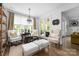 Elegant living room with natural light, classic furnishings, hardwood floors, and French doors to the outside at 7982 Buena Vista Dr, Denver, NC 28037