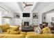 Bright living room with custom built-ins, fireplace, modern lighting, and comfortable seating at 7982 Buena Vista Dr, Denver, NC 28037