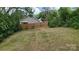 Large, partially fenced backyard with lawn and room for recreation at 925 14Th St, Lancaster, SC 29720