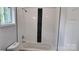 Modern bathroom featuring new shower with white subway tile and a contrasting black tile accent at 925 14Th St, Lancaster, SC 29720