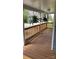 Relaxing front porch featuring a wood railing, wood flooring and hanging plants at 925 14Th St, Lancaster, SC 29720