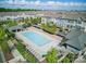Community aerial featuring an inviting pool, lounge area, and well-maintained townhouse exteriors at 9914 Ainslie Downs St, Charlotte, NC 28273