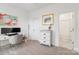 Bright bedroom featuring a desk, decor, and ensuite bathroom with a shower and tub at 9914 Ainslie Downs St, Charlotte, NC 28273