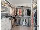 Walk-in closet with custom shelving and organization systems for clothes, shoes, and accessories at 9914 Ainslie Downs St, Charlotte, NC 28273