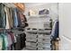 Spacious closet with ample storage solutions, including shelves, drawers, and hanging racks at 9914 Ainslie Downs St, Charlotte, NC 28273
