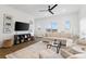 Bright living room with hardwood floors, plush seating, and a large window for ample natural light at 9914 Ainslie Downs St, Charlotte, NC 28273
