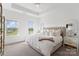 Serene main bedroom with plush carpet, natural light, and neutral decor for a relaxing retreat at 9914 Ainslie Downs St, Charlotte, NC 28273