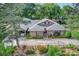 Aerial view of a landscaped home with a carport and swing at 10315 Washam Potts Rd, Cornelius, NC 28031