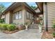 Lovely front entrance featuring a stone walkway and charming flower pots at 10315 Washam Potts Rd, Cornelius, NC 28031