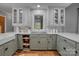 Well-appointed kitchen featuring shaker cabinets, quartz countertops, and modern appliances at 10315 Washam Potts Rd, Cornelius, NC 28031