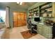 Home office featuring a built in desk, shelving, and hardwood paneled closet at 10315 Washam Potts Rd, Cornelius, NC 28031
