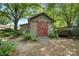 Outdoor shed with barn doors and mature landscaping at 10315 Washam Potts Rd, Cornelius, NC 28031