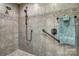 Walk-in shower with multiple shower heads, grab bars, and custom tile at 10315 Washam Potts Rd, Cornelius, NC 28031