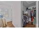 Walk-in closet featuring custom shelving and a wide selection of clothing and shoe storage at 106 N Turner Ave, Charlotte, NC 28216