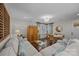 Bright living room with hardwood floors, white sofa, a stylish area rug, and natural light at 106 N Turner Ave, Charlotte, NC 28216