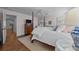 Comfortable main bedroom featuring hardwood floors and a view into an adjoining room at 106 N Turner Ave, Charlotte, NC 28216