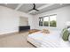 Comfortable main bedroom featuring a bed, bench and large windows overlooking outdoors at 111 Monbo Meadows Ln, Statesville, NC 28677