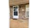 Charming front porch featuring a stylish front door, stone accents, and a welcoming entryway at 1110 Hollyberry Ln, Salisbury, NC 28147