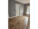 A mud room with tile flooring, a window, and a white entry door, offering practicality and functionality at 1110 Hollyberry Ln, Salisbury, NC 28147