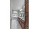 Light-filled bathroom featuring a double vanity with quartz countertop and abundant natural light at 1176 Fawn Ridge Nw Rd, Concord, NC 28027