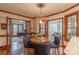 Charming dining area with wood trim, a modern light fixture and access to the office and sunroom at 1176 Fawn Ridge Nw Rd, Concord, NC 28027