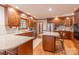 Well-appointed kitchen featuring granite counters, stainless appliances, and wooden cabinets at 1176 Fawn Ridge Nw Rd, Concord, NC 28027
