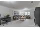 Spacious living room with neutral walls and carpet, sofas, wood coffee table, and desk area at 1176 Fawn Ridge Nw Rd, Concord, NC 28027