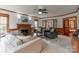 Inviting living room with a fireplace, wood trim, and ample seating, perfect for relaxation at 1176 Fawn Ridge Nw Rd, Concord, NC 28027