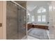 Main bathroom with marble shower, separate tub, and dual vanities at 1176 Fawn Ridge Nw Rd, Concord, NC 28027