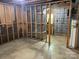 Unfinished basement featuring concrete floor, exposed studs, and utilities, ready for customization at 1199 Riding Trail Ln, Concord, NC 28027