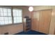 Bedroom with wood paneling, built-in bookshelf, closet, and natural lighting at 1199 Riding Trail Ln, Concord, NC 28027