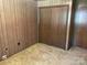 Bedroom with wood paneled walls, wall to wall carpet and built in closet at 1199 Riding Trail Ln, Concord, NC 28027