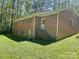 Brick home with large backyard, several windows, and an exterior staircase at 1199 Riding Trail Ln, Concord, NC 28027