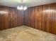 Empty room showcasing panelled walls, chandelier lighting, and ample space at 1199 Riding Trail Ln, Concord, NC 28027