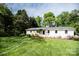 Charming ranch-style home featuring a well-maintained lawn and mature trees at 1201 Robinhood Cir, Charlotte, NC 28227