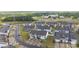 An aerial view of a neighborhood of new construction townhomes with modern exteriors and manicured lawns at 1245 Pebble Grove Dr, Clover, SC 29710
