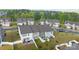 Aerial view of townhomes featuring fenced backyards with patios, ideal for relaxation and outdoor entertaining at 1245 Pebble Grove Dr, Clover, SC 29710