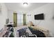 Contemporary bedroom featuring sleek furniture, a large TV, and gaming-themed decor at 1245 Pebble Grove Dr, Clover, SC 29710