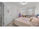 A cozy bedroom with a floral-themed bed and unicorn wall decor, perfect for  at 1245 Pebble Grove Dr, Clover, SC 29710