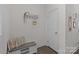 Well-lit foyer with a storage bench, coat rack, and stylish decor at 1245 Pebble Grove Dr, Clover, SC 29710