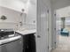 Modern laundry room with shelving, countertop, and front-load washer and dryer at 1245 Pebble Grove Dr, Clover, SC 29710